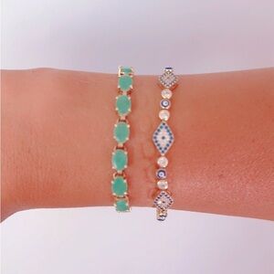 14k yellow gold emerald tennis bracelet .